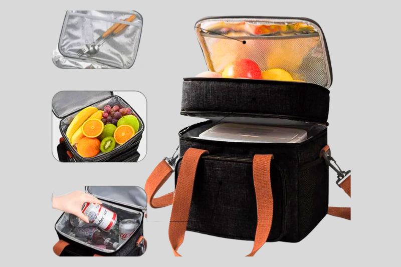 Bolsa térmica preta aberta com frutas e recipiente no interior isolado termicamente.