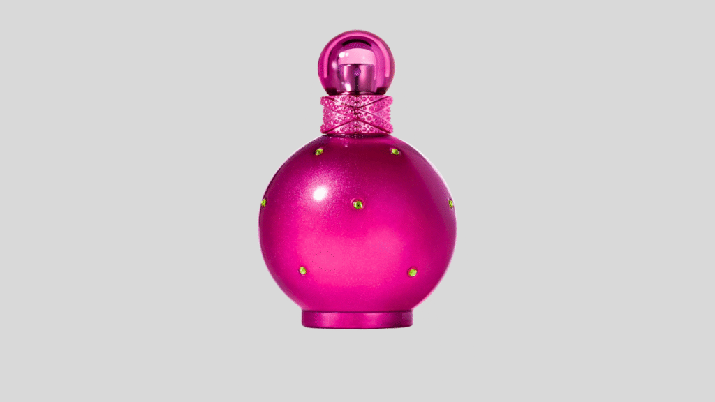 Frasco de perfume feminino rosa vibrante, representando fragrâncias importadas populares em 2026.